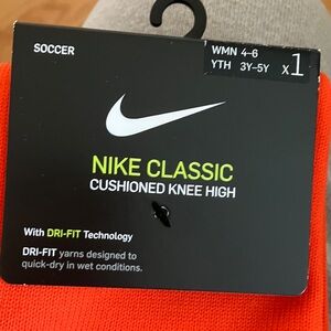 Nike Cushioned Knee-High Soccer Socks in Bright Orange